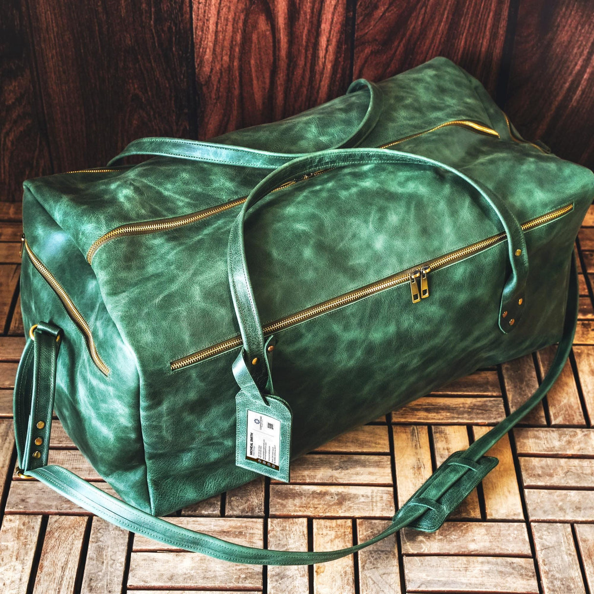 a green bag sitting on top of a wooden floor