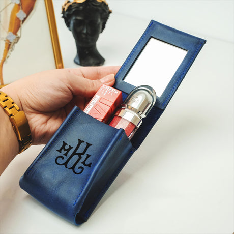 a person holding a blue case with a lock on it