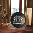 a wooden table topped with a plaque and a book