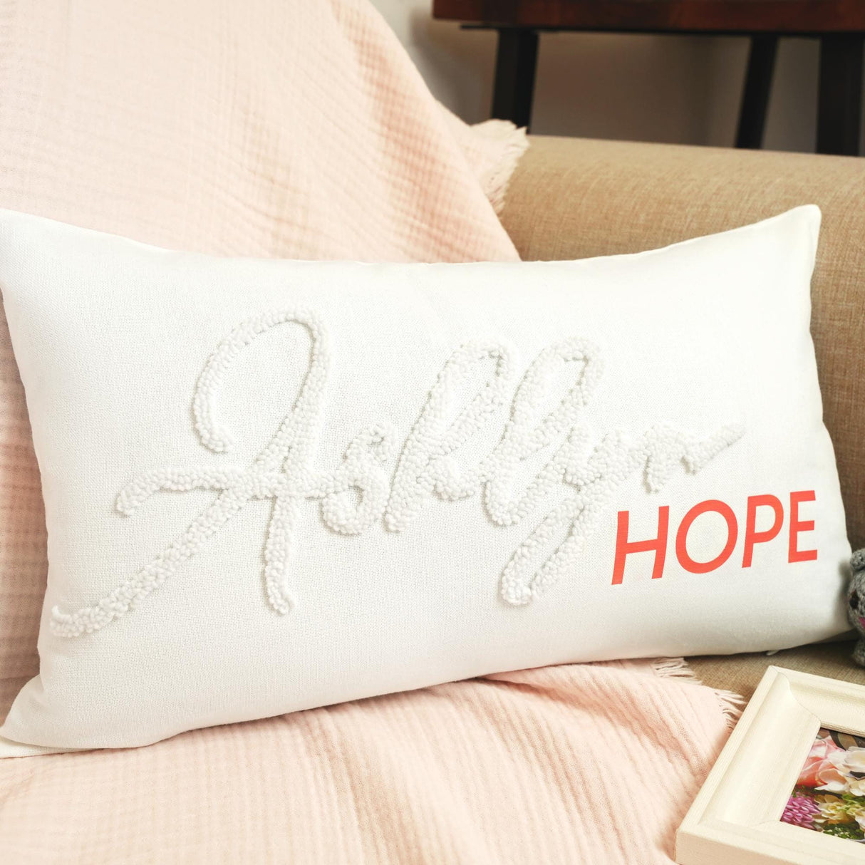 a white pillow with the word hope on it