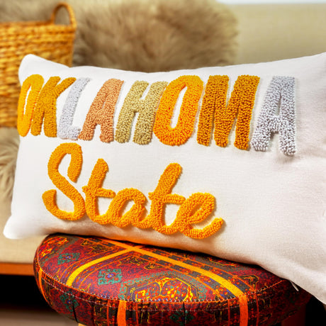 a white pillow with the words akom state on it