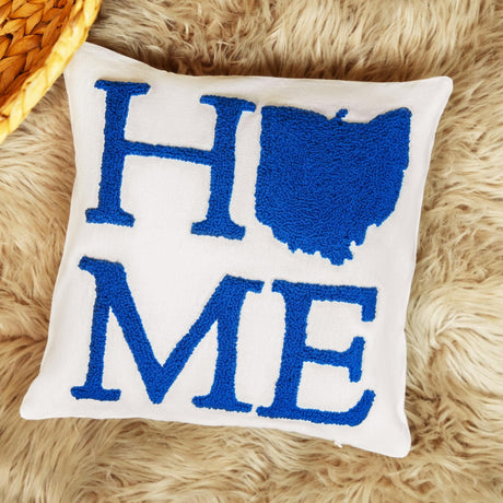 a pillow with the word home on it