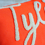 a close up of a pillow with the word joy on it