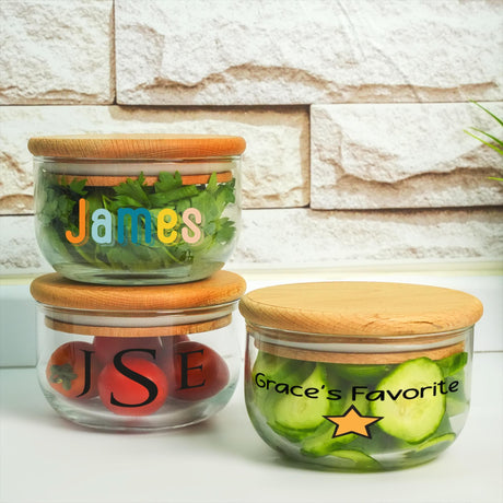 three jars with vegetables in them sitting on a counter