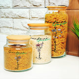 three jars of food sitting on a counter