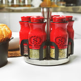 a group of spice jars sitting on top of a counter