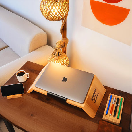 a wooden table with a laptop on top of it