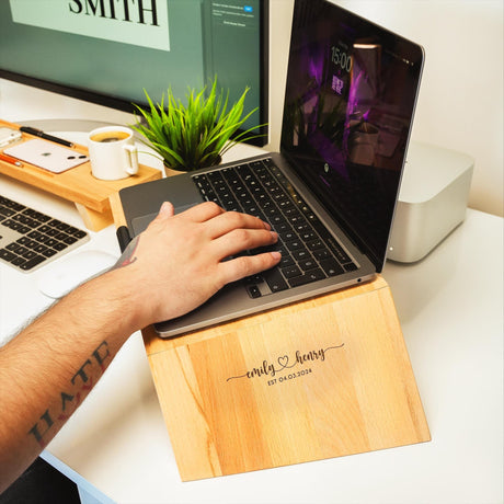 a person using a laptop on a desk