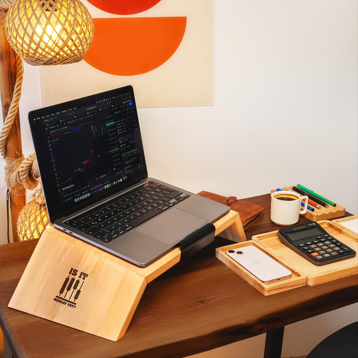 a laptop computer sitting on top of a wooden desk