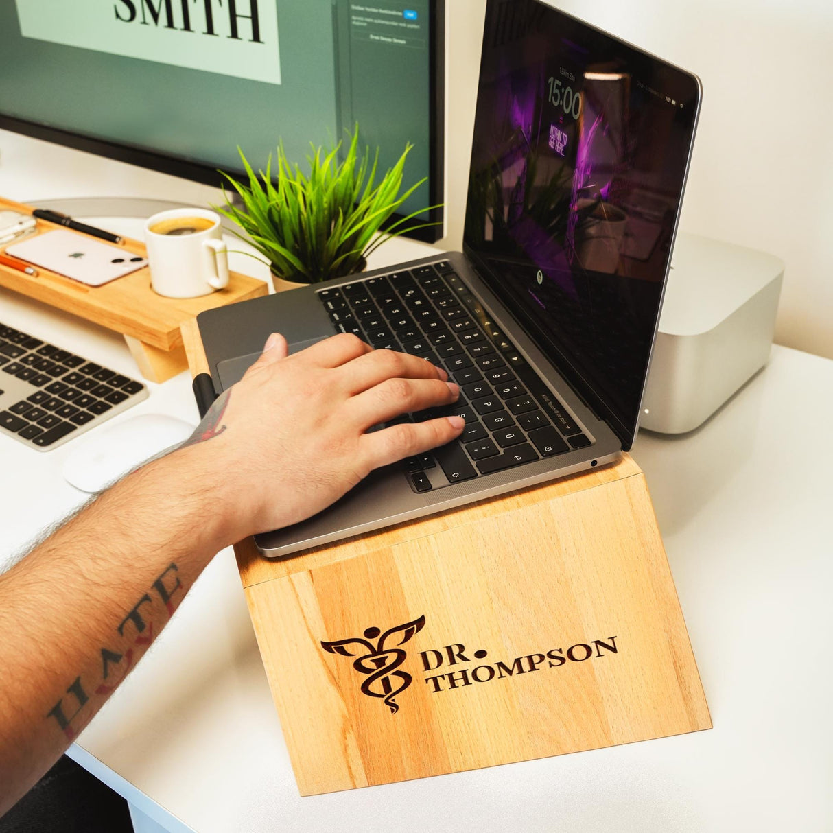 a person using a laptop on a desk