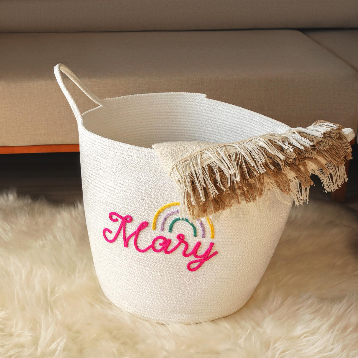 a white basket with the word mary painted on it