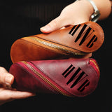 a person holding a wallet with the word ise written on it