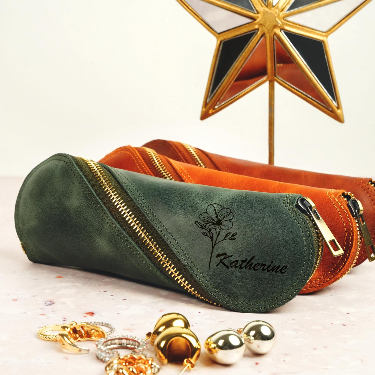 a green and orange bag with a star on top of it