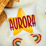 a white pillow with the word aurora on it