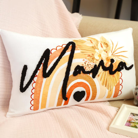 a decorative pillow with a name on it