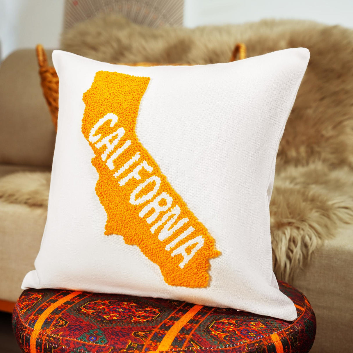 a pillow with the state of california embroidered on it