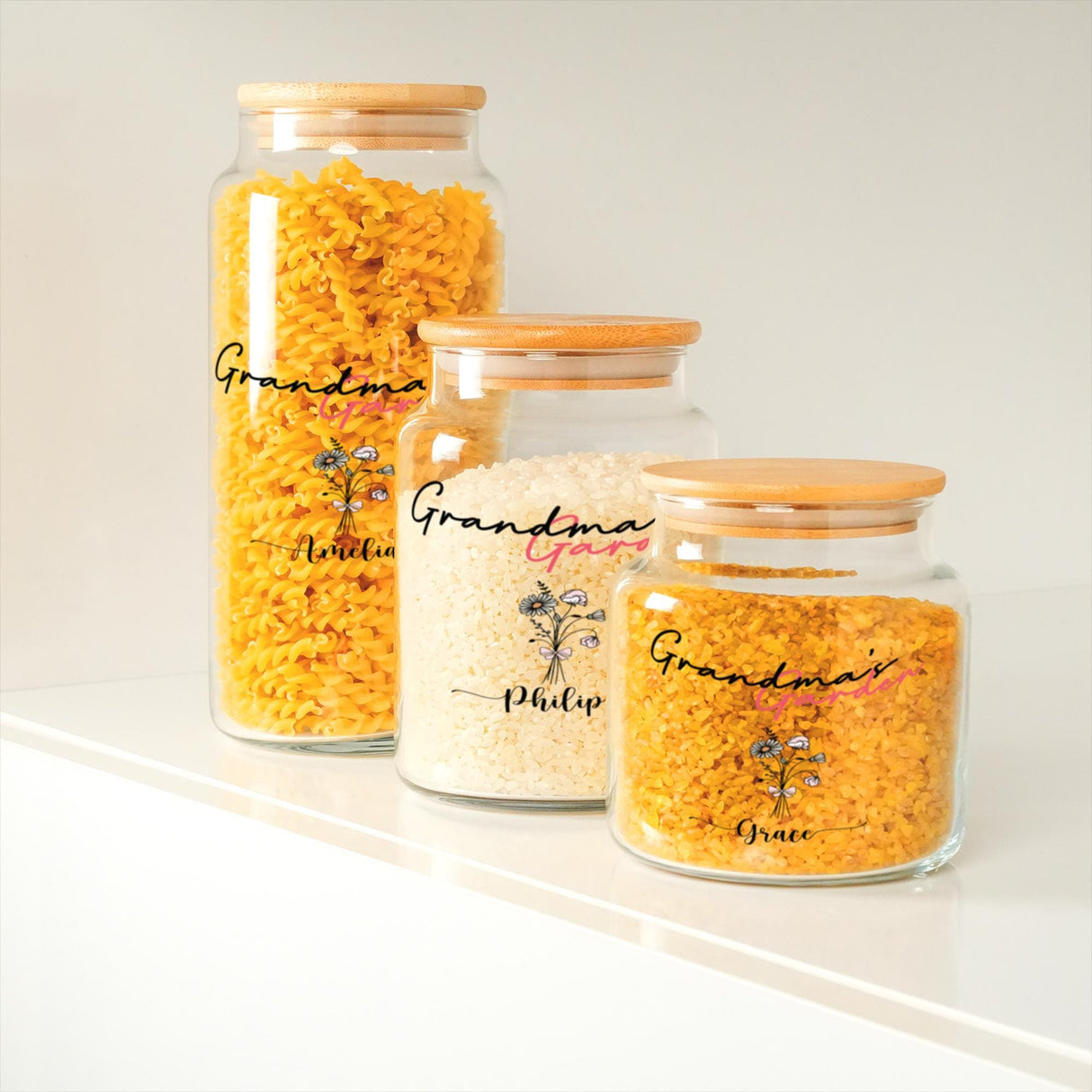 three glass jars filled with yellow and white rice