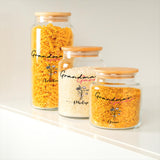 three glass jars filled with yellow and white rice